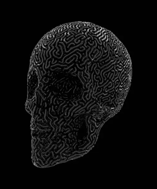 Photo of Metal Carved Skull Isolated On Black