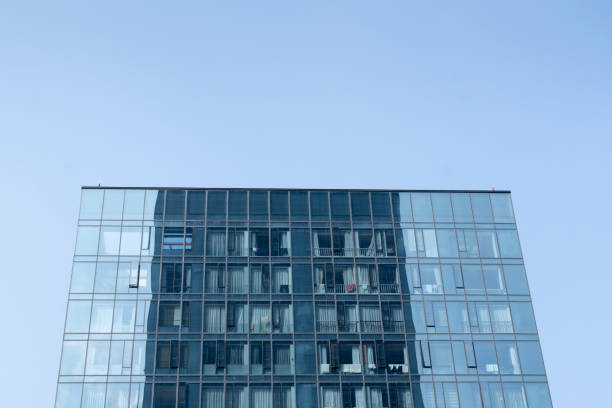istock Modern office buildings under blue sky and white clouds 1312143522