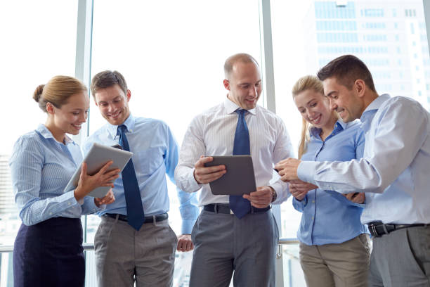 istock business people with tablet pc and smartphones 1312143774
