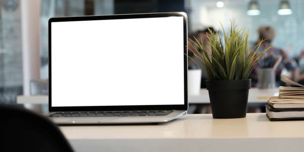 istock Blank screen Laptop computer and poster workspace background in modern office 1312145226