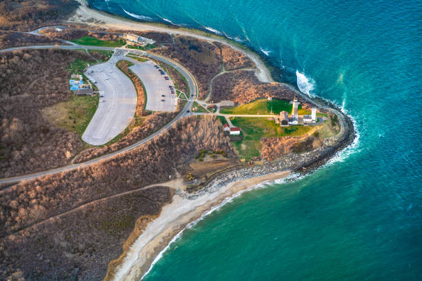Aerial view over Long Island with Montauk Point Lighthouse Aerial view over Long Island with Montauk Point Lighthouse and ocean in view montauk point stock pictures, royalty-free photos & images