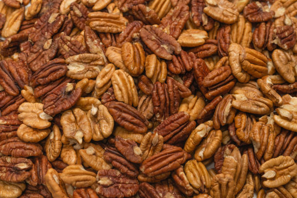 istock Tasty pecan-nut background. Top view. 1312146199