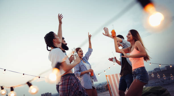 istock Having a great time with friends, having fun at rooftop party 1312149388