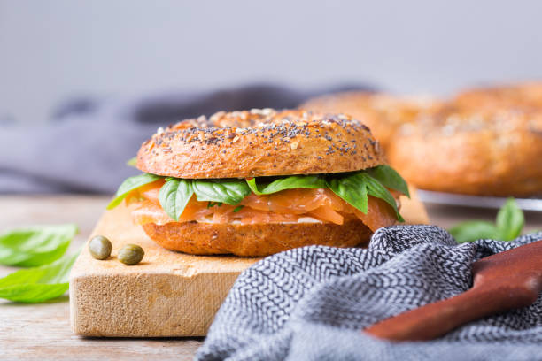 istock Bagels with cream cheese and salmon. Plating, fast lunch, meal. 1312149638