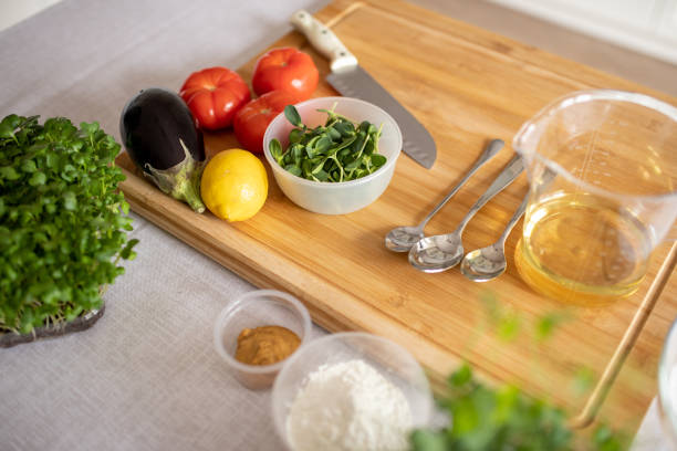 istock Kitchen table with the ingredients for cooking healthy food 1312149646