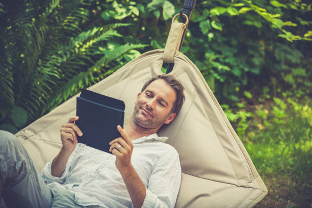 smart working, man with tablet in the garden