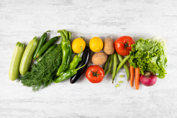 istock Fresh and Raw Vegetables on Wooden Kitchen Table 1312152277