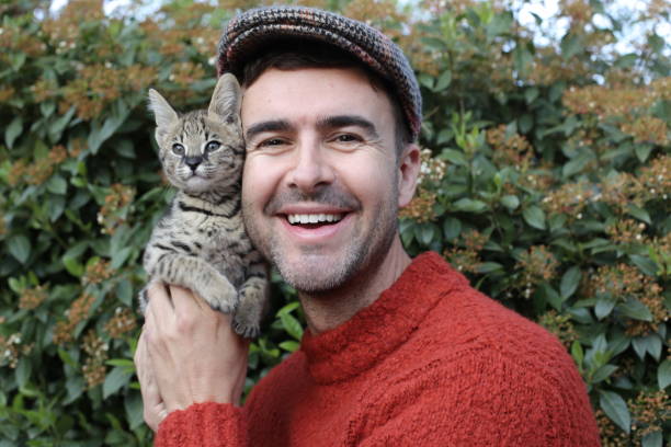 istock Man with baby cat 1312153411