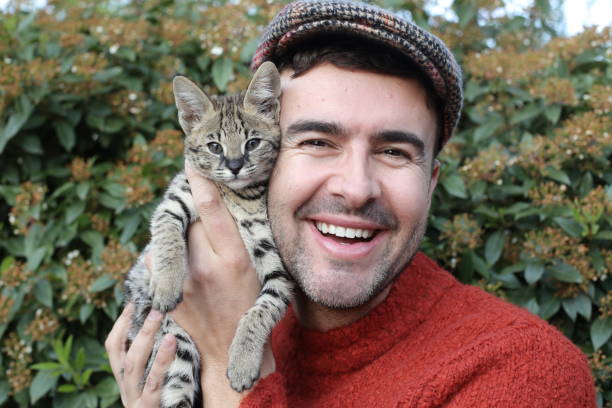 istock Man with baby cat 1312153443