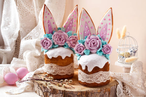 istock easter cake decorated with rabbit ears and roses meringue flowers on a light background 1312153474