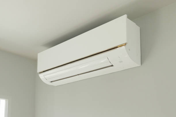 istock Air conditioner on white wall room interior background 1312153632