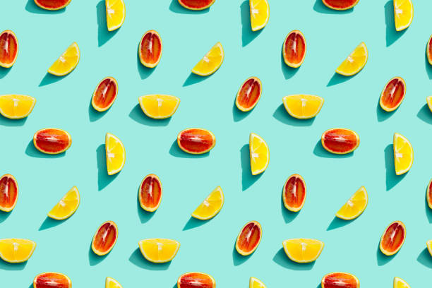 istock Colorful fruit pattern from fresh citrus, lemon, red orange on blue background. Summer food. 1312156143