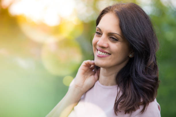istock Beautiful middle-age woman in black leather jacket smiling broadly. 1312156286