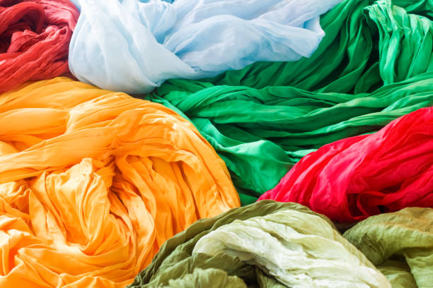 istock Bright silk scarves, yellow, blue, red, green. 1312159571