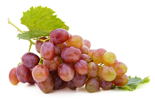 One bunch of red grapes isolated on a white background.