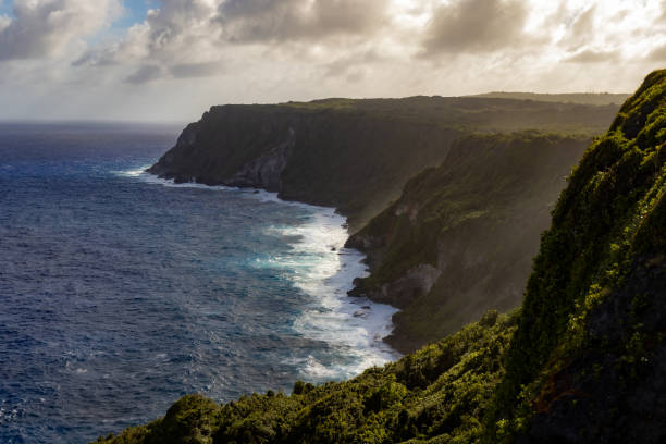 Wavy Island Coastline The Coastline of Guam on a windy day pushing the waves against the shoreline guam stock pictures, royalty-free photos & images