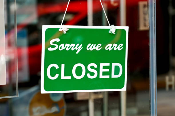 istock Sorry, we are closed sign in a shop window 1312171661