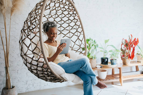 istock A senior woman using the digital tablet at home 1312173063