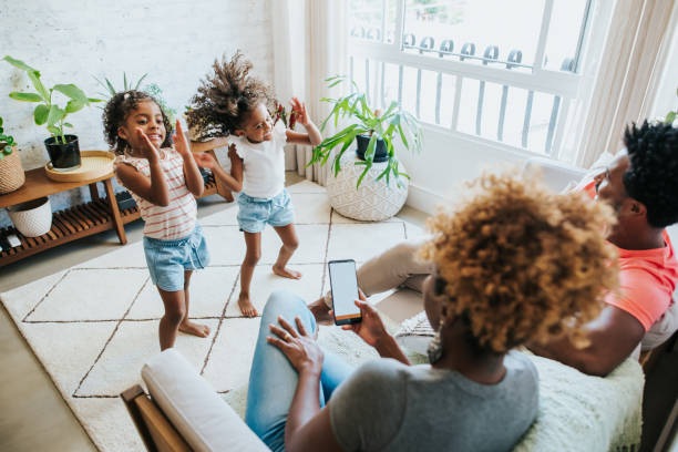 istock Happy family dancing at home 1312173650