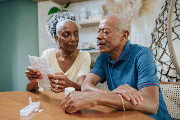 istock Senior adult taking medication at home 1312173653