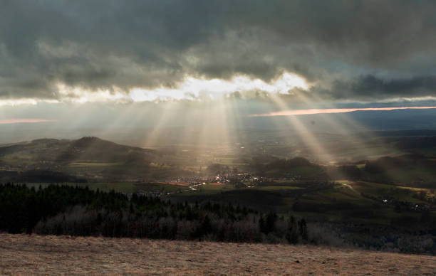 istock The sun's rays cut through the overhanging dark clouds 1312174696