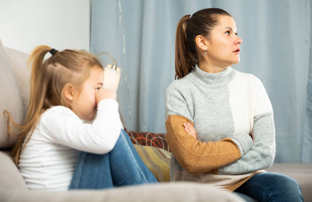 istock Woman having communication conflict with small daughter crying 1312174831