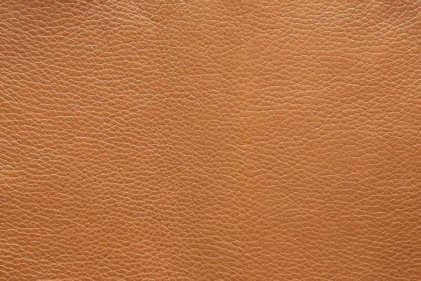 istock Surface texture of metallic light brown leather, background. 1312177257