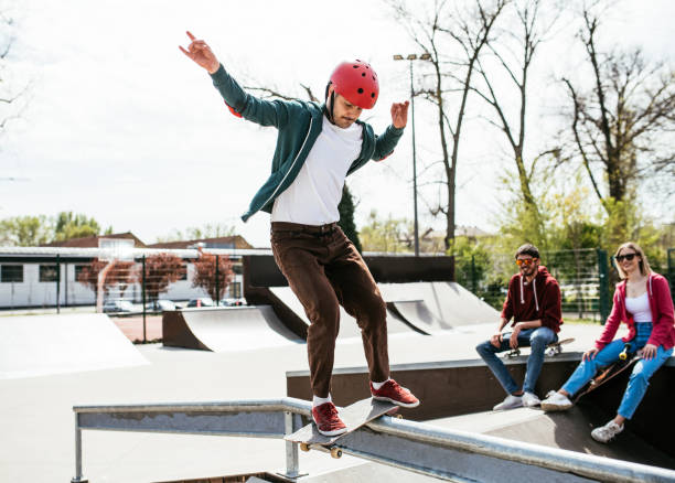 istock Skateboarder showing tricks and jumps in skate park 1312177343