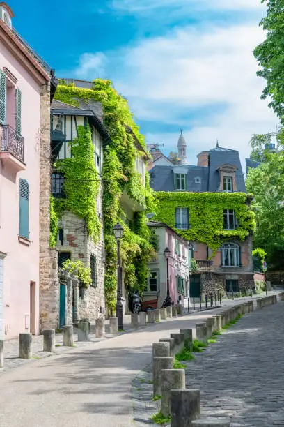 Paris, France, famous pink house and buildings in Montmartre, in a typical street