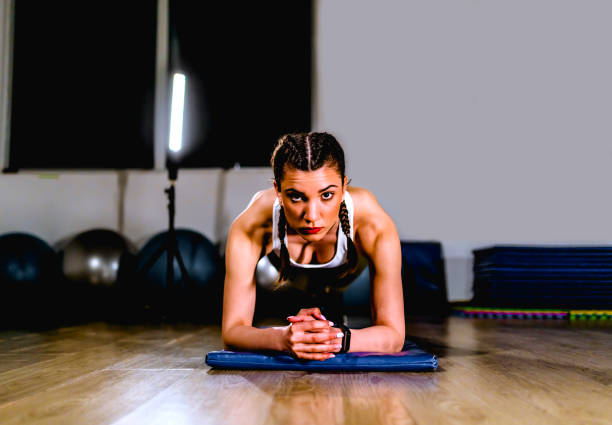 istock Fit woman in plank position 1312183111