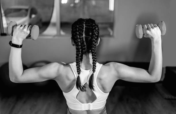 istock Woman working out with dumbbells 1312184168