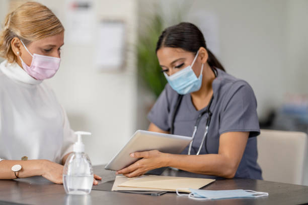 istock Masked Medical Appointment 1312184224