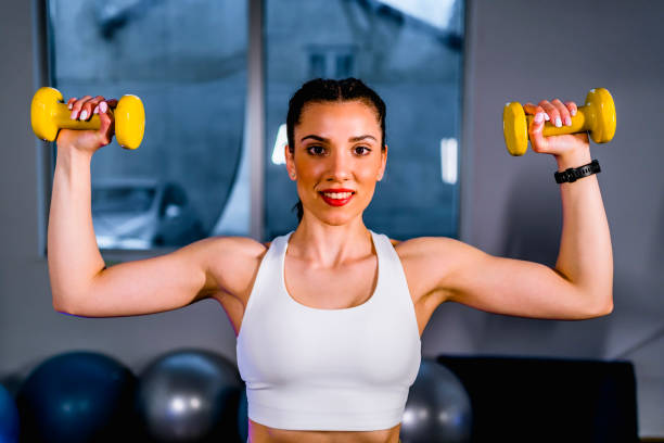 istock Cheerful woman working out 1312184999
