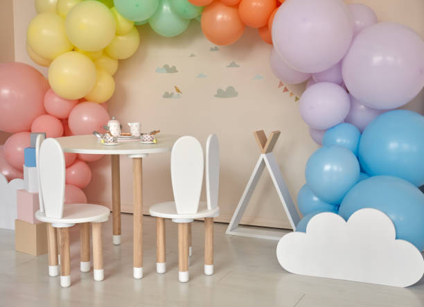 istock Small table and chairs with bunny ears in children's room interior 1312185060