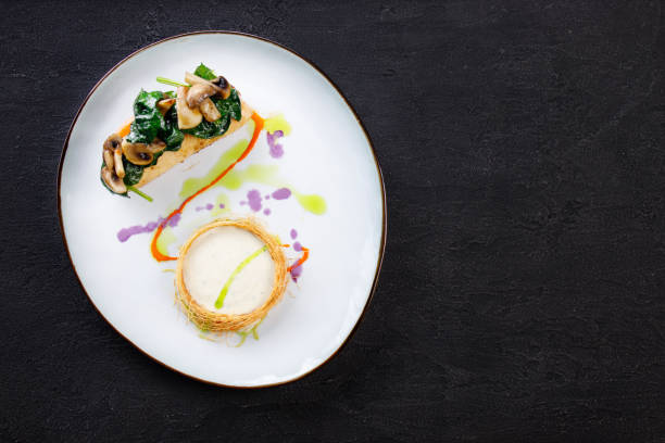 istock Chicken breasts with cheese and vegetable garnish 1312185592