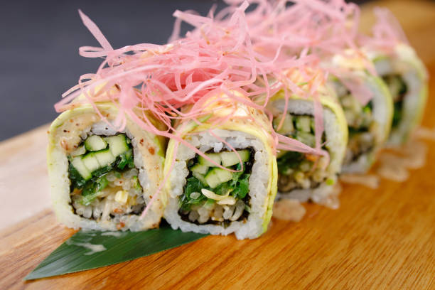 istock Cucumber and avocado sushi rolls, vegan food 1312185675