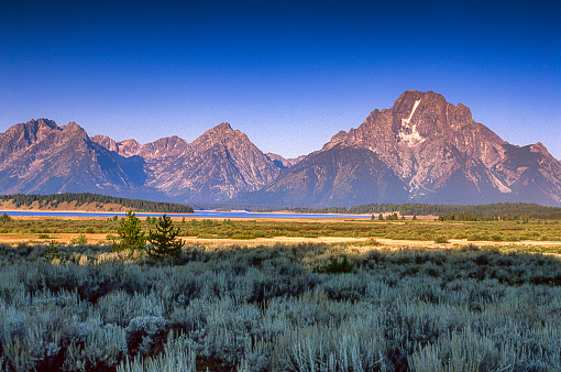 Mount Moran in the Grand Teton Mountain Range and high desert landscape.\n\nTaken in the Grand Tetons National Park, Wyoming, USA