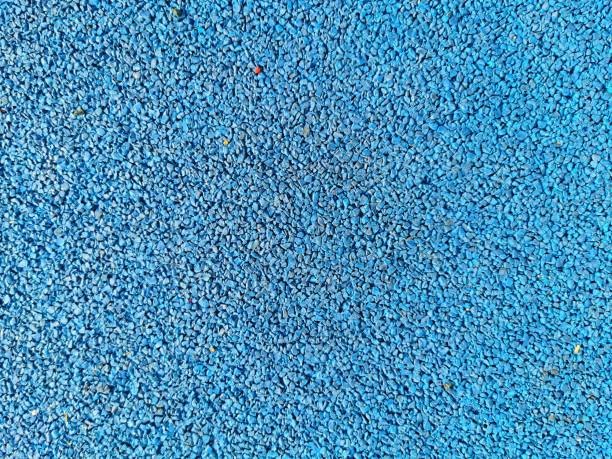 istock Texture of small blue rubber rocks 1312186633