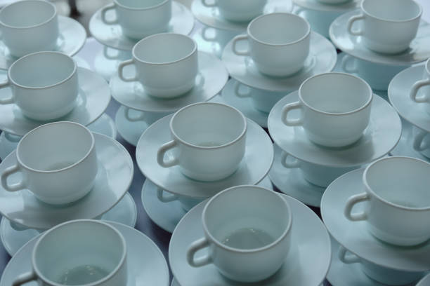 istock Pattern of a group of empty white cups and  sausers for coffee and tea 1312187703
