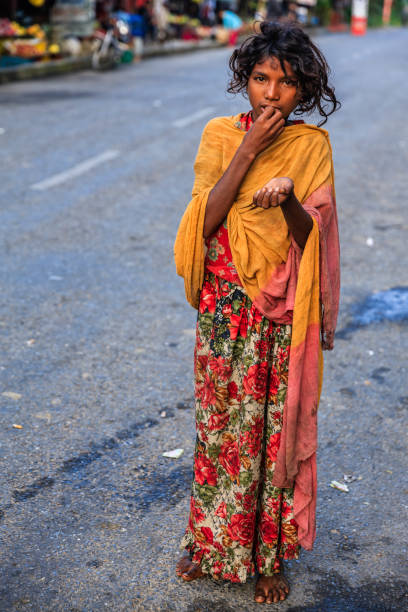 istock Poor Indian girl asking for help 1312188306