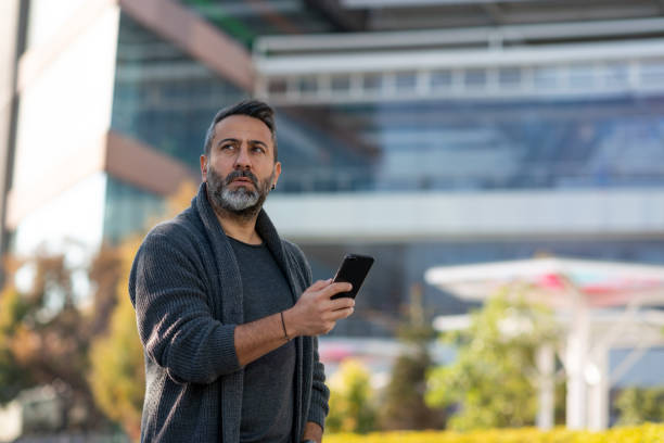 istock Bad news! Worried man looking thoughtfully away. 1312189135