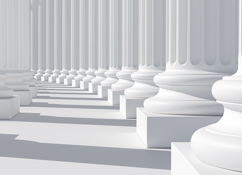 Row of white marble columns, colonnade, bright light