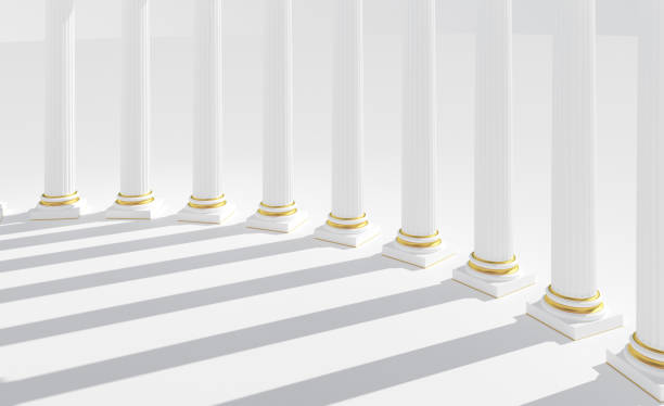istock White columns with golden details, shadows, sunlight 1312191594