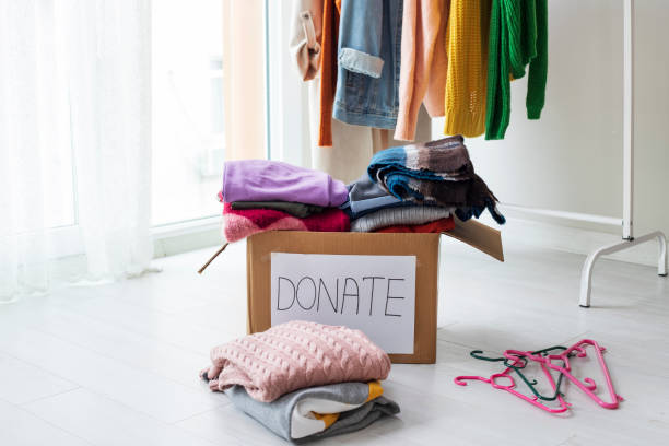 istock Donation box with clothes in the room 1312193935