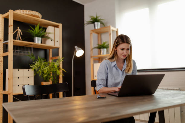 istock Smiling beautiful student passing online exams during pandemic. 1312195462
