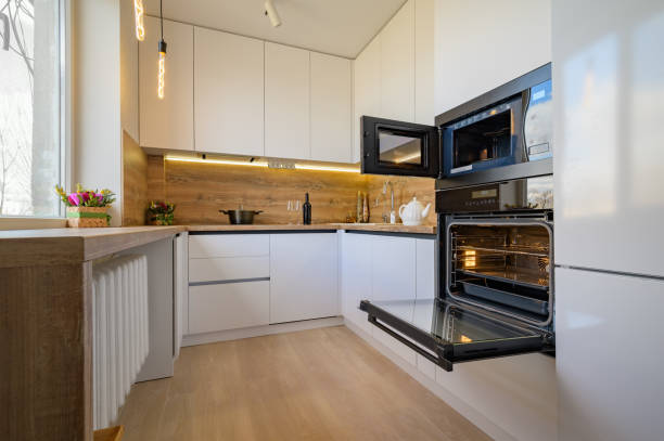 istock Modern white and beige wooden kitchen interior with oven opened 1312197217