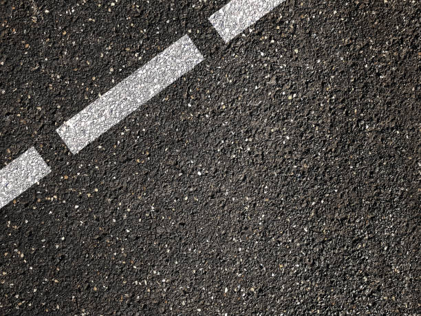istock Asphalt road with dividing white line 1312198397