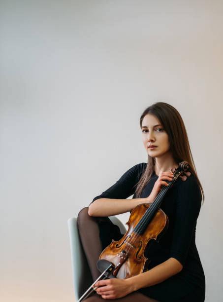 istock female violinist portrait studio shooting classic 1312202184