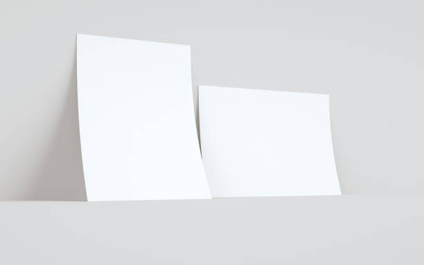 istock A4 Flyer / Letterhead Mock-Up - Two Flyers Against Wall Background 1312202535