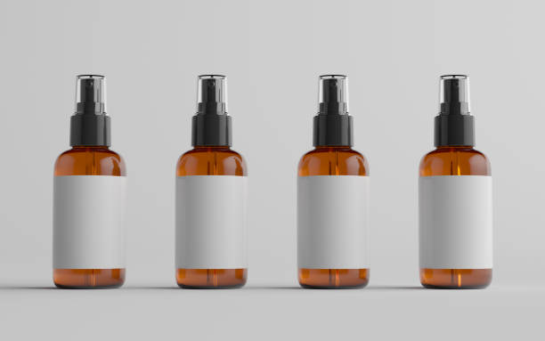 istock Amber Spray Bottle Mockup - Multiple Bottles. Blank Label 1312203169